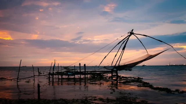 Traditional Chinese fishing nets at sunset in Fort Kochi Kerala