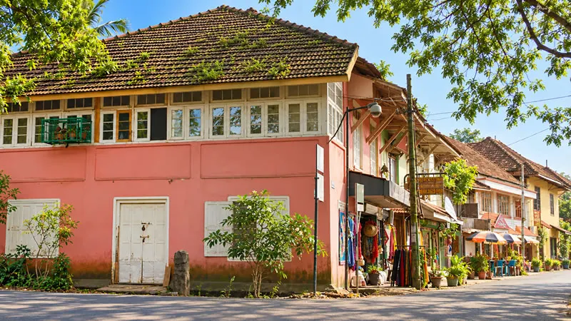 Heritage buildings along a shaded street in Fort Kochi