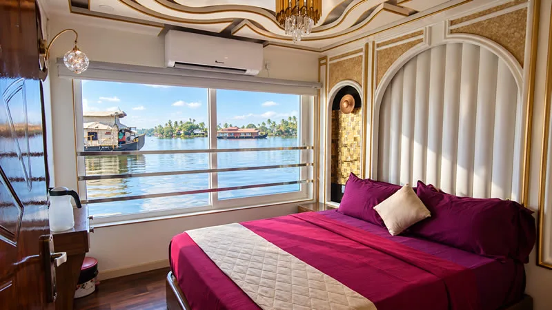 Houseboat bedroom with a view over Kerala’s backwaters