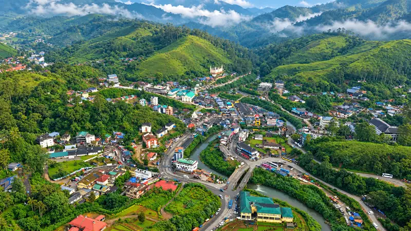 Aerial view of Munnar town surrounded by green hills
